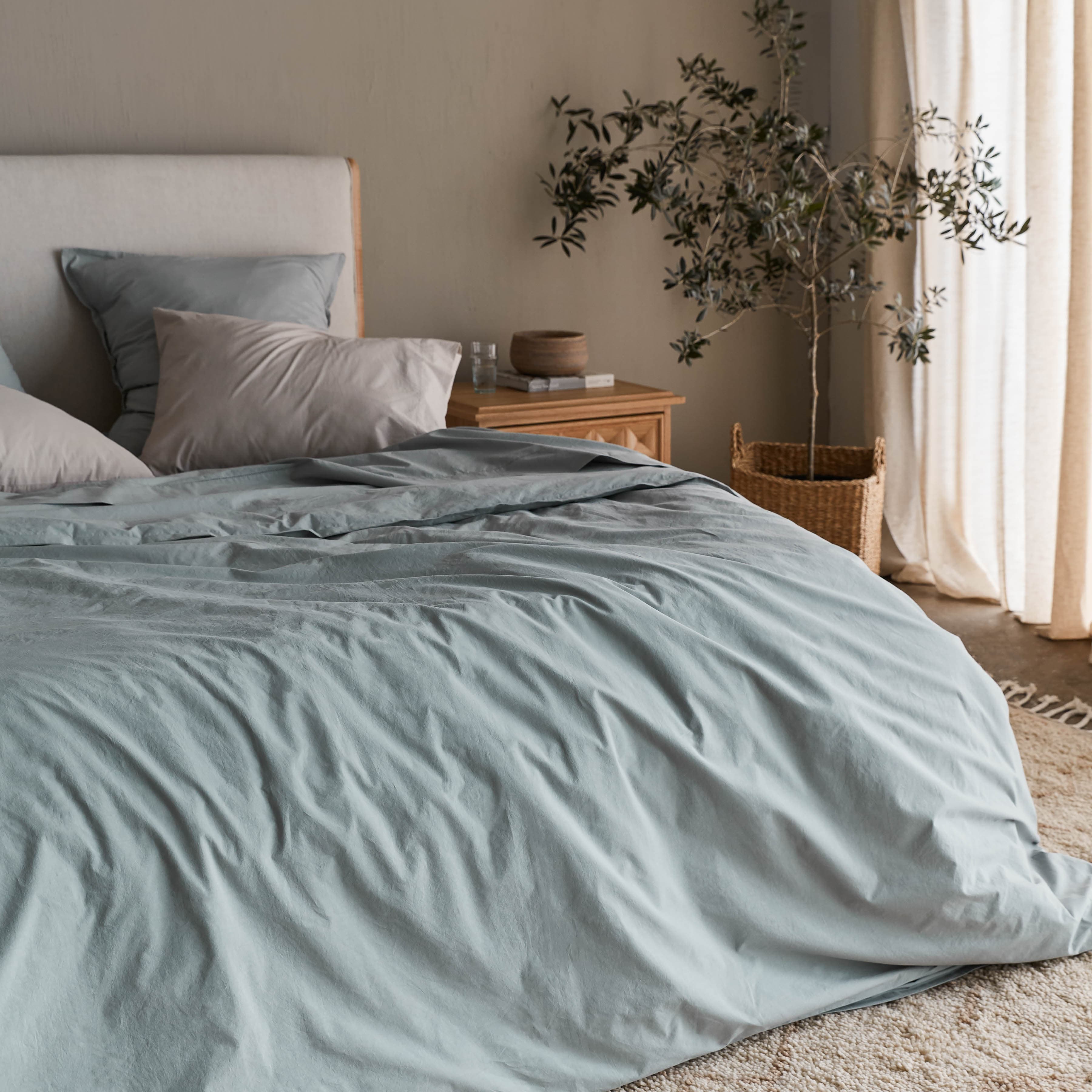 Soft textiles arranged in a calm interior